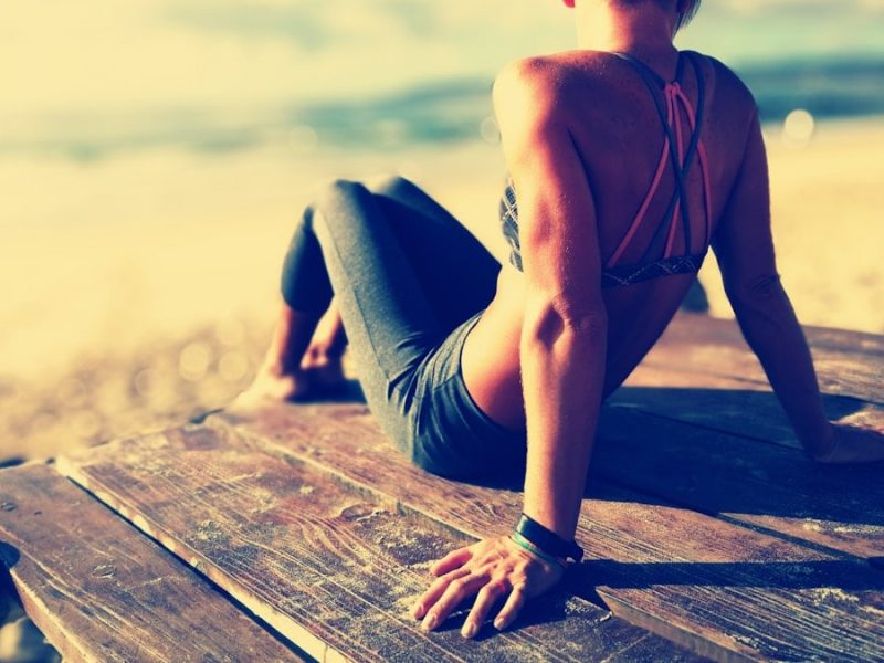 woman wearing fitted pants and sports bra